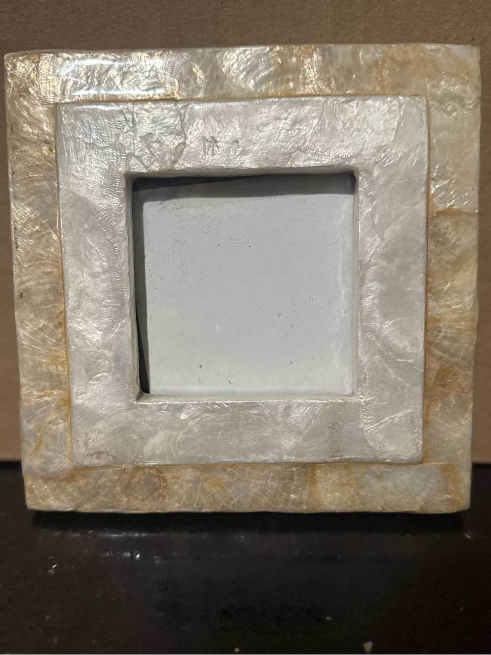 This alabaster frame is: natural stone texture with subtle cream and beige tones